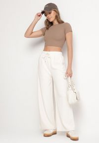 Born2be - Białe Szerokie Spodnie z Wysokim Stanem Wiązane Sznurkiem Cosetta. Okazja: na co dzień. Stan: podwyższony. Kolor: biały. Styl: elegancki, casual #3