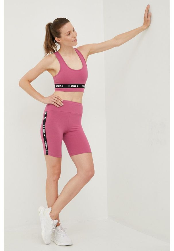 Guess szorty damskie kolor fioletowy z nadrukiem medium waist. Kolor: fioletowy. Wzór: nadruk