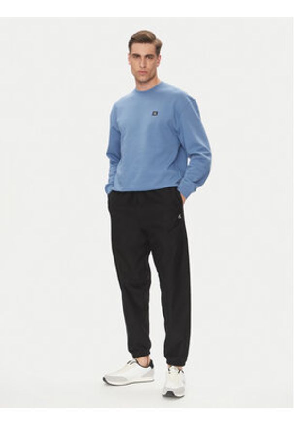 Calvin Klein Jeans Spodnie dresowe Premium LV04RC279G Czarny Regular Fit. Kolor: czarny. Materiał: bawełna
