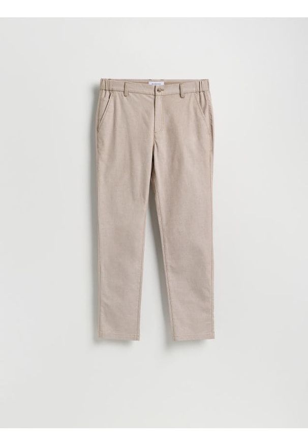 Reserved - Spodnie chino slim fit - beżowy. Kolor: beżowy. Materiał: tkanina, bawełna
