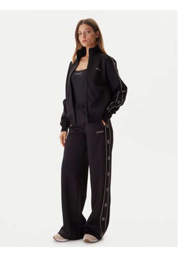 Guess Spodnie dresowe V5BB12 KCX22 Czarny Wide Leg. Kolor: czarny. Materiał: syntetyk