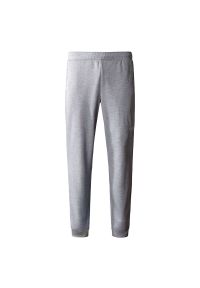 Spodnie The North Face Joggers Reaxion 0A7Z9PDYX1 - szare. Kolor: szary. Materiał: polar, poliester, dresówka