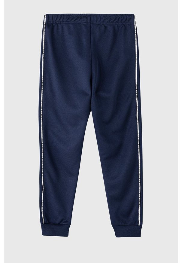 Nike Kids Spodnie dziecięce kolor granatowy gładkie. Kolor: niebieski. Materiał: dzianina. Wzór: gładki
