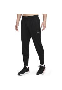 Spodnie Nike Totality FB7509-010 - czarne. Kolor: czarny. Materiał: materiał, poliester, skóra, dresówka. Technologia: Dri-Fit (Nike)