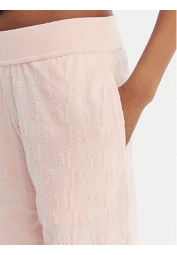 Hugo - HUGO Spodnie dresowe Monogram 50556809 Różowy Regular Fit. Kolor: różowy. Materiał: bawełna