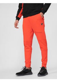 4f - Spodnie dresowe joggery męskie. Kolor: pomarańczowy. Materiał: dresówka #2