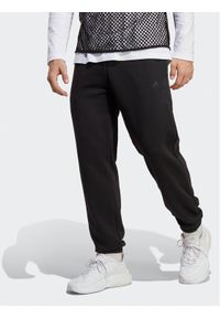 Adidas - adidas Spodnie dresowe ALL SZN IC9770 Czarny Regular Fit. Kolor: czarny. Materiał: bawełna