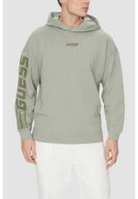 Guess - GUESS Zielona bluza męska Dalim Over z kapturem. Typ kołnierza: kaptur. Kolor: zielony