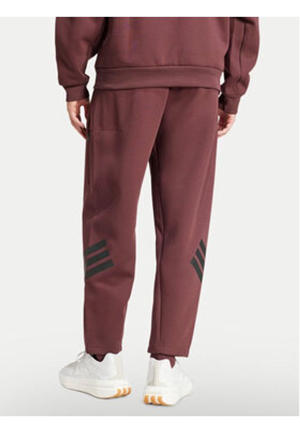 Adidas - adidas Spodnie dresowe Future Icons 3-Stripes JD4888 Bordowy Loose Fit. Kolor: czerwony. Materiał: bawełna