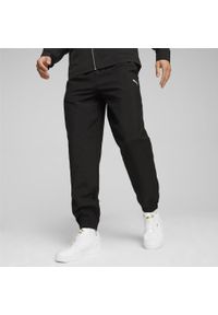 Spodnie sportowe męskie Puma Woven. Kolor: czarny