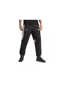 Spodnie Puma BMW MMS MT7+ Woven. Kolor: czarny, biały, wielokolorowy. Sport: fitness #1