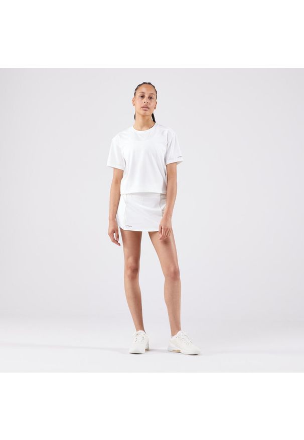 ARTENGO - Koszulka tenisowa krótki rękaw damska Artengo Crop Top DRY. Kolor: biały. Materiał: materiał, elastan, poliester. Długość rękawa: krótki rękaw. Długość: krótkie. Sport: tenis
