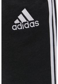 Adidas - adidas Spodnie męskie kolor czarny gładkie. Kolor: czarny. Wzór: gładki