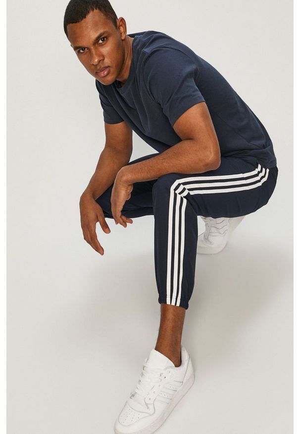 Adidas - adidas - Spodnie. Kolor: niebieski. Materiał: tkanina, poliester. Wzór: gładki