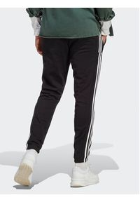 Adidas - adidas Spodnie dresowe Essentials French Terry Tapered Elastic Cuff 3-Stripes Joggers IC0050 Czarny Regular Fit. Kolor: czarny. Materiał: bawełna, dresówka #4