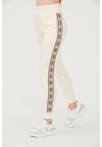 Guess - GUESS Beżowe damskie spodnie dresowe Britney Jogger, Rozmiar XL. Kolor: beżowy. Materiał: dresówka