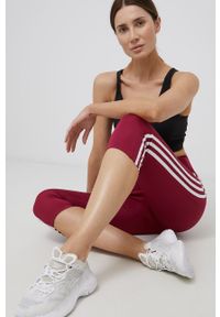Adidas - adidas legginsy treningowe HD6760 damskie kolor fioletowy gładkie. Kolor: fioletowy. Materiał: skóra, materiał. Wzór: gładki. Sport: fitness