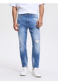 Reserved - Jeansy carrot slim z przetarciami - niebieski. Kolor: niebieski #1
