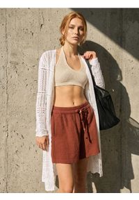 Sinsay - Luźne muślinowe szorty z kieszeniami - żółty. Kolor: żółty