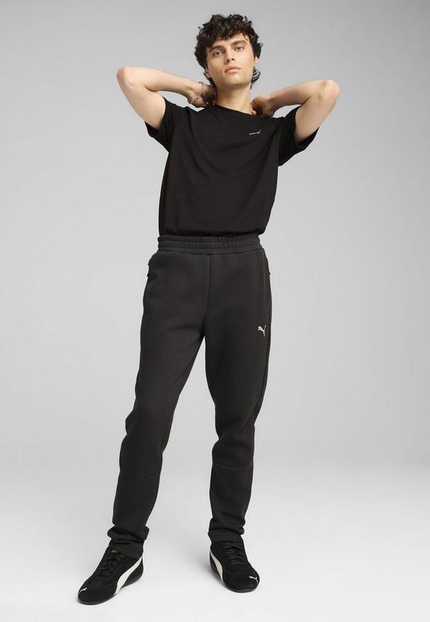 Puma - Męskie spodnie EVOSTRIPE PUMA Black. Kolor: czarny