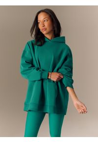 4f - 4F Bluza dresowa loose z kapturem damska - zielona L. Okazja: na co dzień. Typ kołnierza: kaptur. Kolor: zielony. Materiał: dresówka. Styl: casual #2