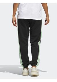 Adidas - adidas Spodnie dresowe Tape HM1530 Czarny Regular Fit. Kolor: czarny. Materiał: dresówka, bawełna
