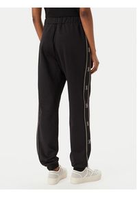Guess Spodnie dresowe V5BB23 KCX22 Czarny Wide Leg. Kolor: czarny. Materiał: syntetyk #3