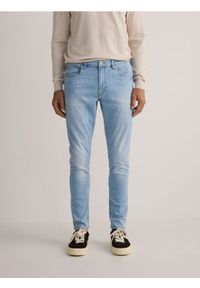 Reserved - Jeansy skinny z efektem sprania - niebieski. Kolor: niebieski