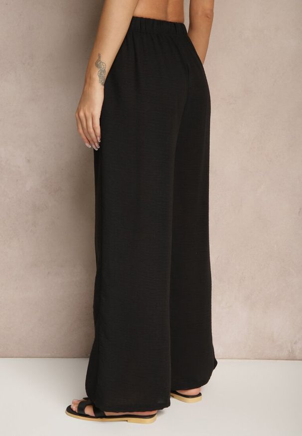 Renee - Czarne Spodnie Palazzo o Szerokim Kroju High Waist Ollevia. Okazja: na co dzień, na spotkanie biznesowe. Stan: podwyższony. Kolor: czarny. Materiał: jedwab. Wzór: aplikacja. Styl: biznesowy, elegancki, casual