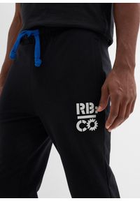 bonprix - Spodnie sportowe z kontrastowymi elementami. Kolor: czarny. Materiał: dresówka, poliester. Wzór: nadruk. Styl: sportowy #2