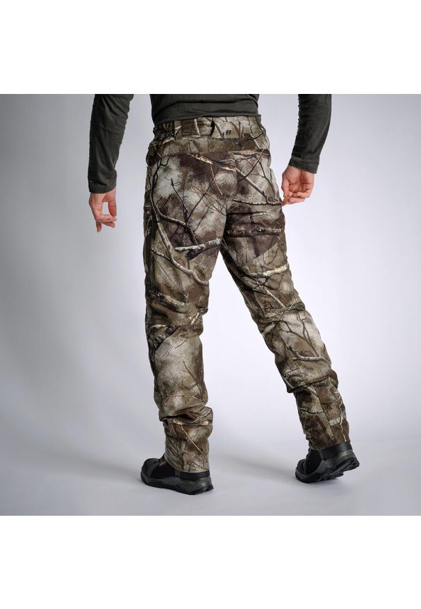 SOLOGNAC - Spodnie Solognac Warm 900 camo treemetic wodoodporne. Kolor: wielokolorowy, brązowy, zielony. Materiał: skóra, materiał, tkanina, polar. Sport: outdoor