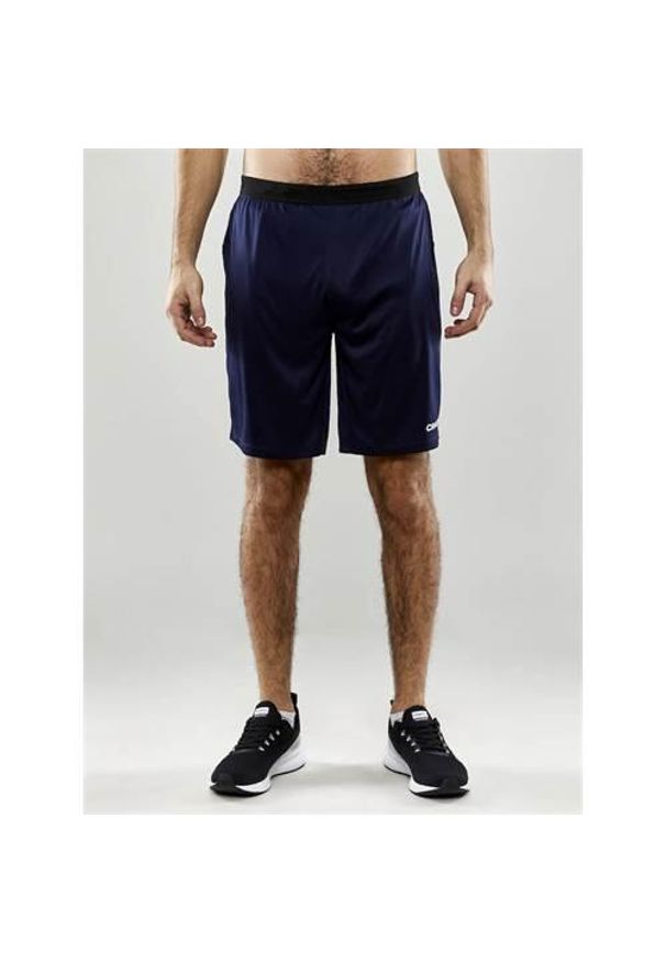 Spodnie treningowe męskie Craft Progress 2.0. Kolor: niebieski. Długość: krótkie. Sport: fitness