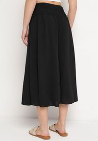 Born2be - Czarne Spodnie Szerokie o Długości 3/4 z Gumką w Pasie Marinesta. Kolor: czarny. Materiał: materiał, tkanina. Sezon: wiosna, lato #6