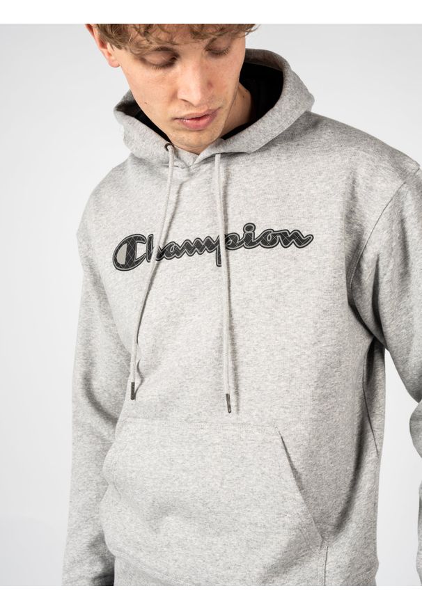 Champion Bluza "Hoodie" | HBGF89H586N9A | Mężczyzna | Szary. Okazja: na co dzień. Typ kołnierza: kaptur. Kolor: szary. Materiał: poliester, bawełna. Wzór: aplikacja. Styl: casual