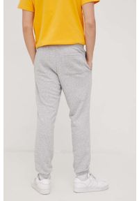 New Balance spodnie dresowe MP21503AG męskie kolor szary melanżowe. Kolor: szary. Materiał: dresówka. Wzór: melanż #2