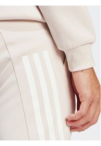 Adidas - adidas Spodnie dresowe Future Icons 3-Stripes IR9155 Różowy Slim Fit. Kolor: różowy. Materiał: bawełna #5