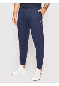 Tommy Jeans Spodnie dresowe DM0DM15380 Granatowy Slim Fit. Kolor: niebieski. Materiał: syntetyk, bawełna