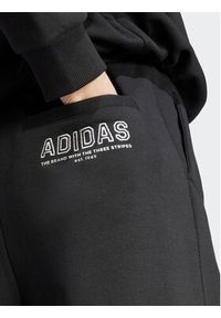 Adidas - adidas Spodnie dresowe IR8377 Czarny Loose Fit. Kolor: czarny. Materiał: bawełna, dresówka