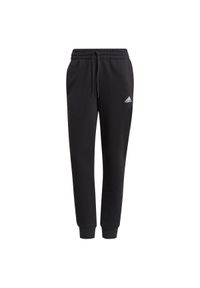Adidas - Spodnie damskie adidas Essentials Slim. Kolor: czarny, wielokolorowy, biały. Materiał: dresówka. Długość: długie. Sport: fitness #1
