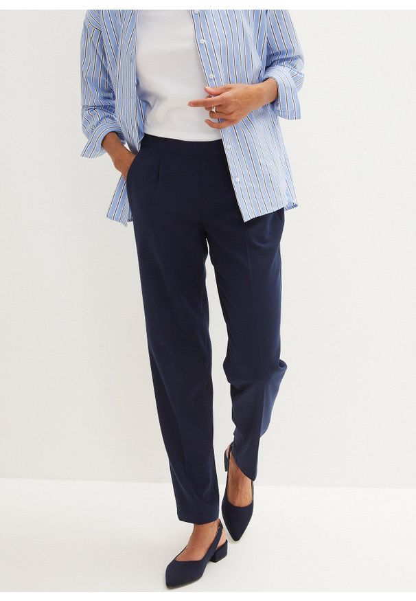bonprix - Spodnie z elastyczną gumką w talii i zaprasowanym kantem. Kolor: niebieski. Styl: klasyczny