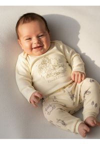 Sinsay - Spodnie z polarem w środku Winnie the Pooh - kremowy. Kolor: kremowy. Materiał: polar #1