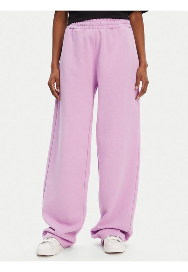 Hugo - HUGO Spodnie dresowe Nolasa_B 50545019 Różowy Loose Fit. Kolor: różowy. Materiał: bawełna