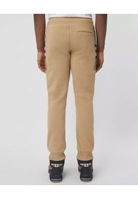 Burberry - BURBERRY - Beżowe spodnie z panelami w kratkę. Kolor: beżowy. Materiał: bawełna. Wzór: kratka