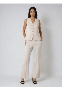 Sinsay - Eleganckie spodnie flare - kremowy. Kolor: kremowy. Styl: elegancki