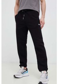 Fila spodnie dresowe kolor czarny gładkie. Kolor: czarny. Materiał: dresówka. Wzór: gładki