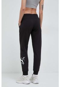 Puma spodnie dresowe kolor czarny z nadrukiem. Kolor: czarny. Materiał: dresówka. Wzór: nadruk #4