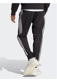 Adidas - adidas Spodnie dresowe AEROREADY Essentials Tapered Cuff Woven 3-Stripes Joggers IC0041 Czarny Regular Fit. Kolor: czarny. Materiał: syntetyk