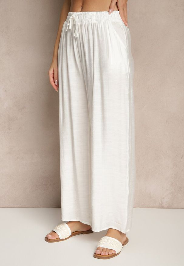 Renee - Jasnobeżowe Spodnie z Wiskozy High Waist o Szerokim Kroju Divlise. Okazja: na co dzień. Stan: podwyższony. Kolor: beżowy. Materiał: wiskoza. Styl: elegancki, casual