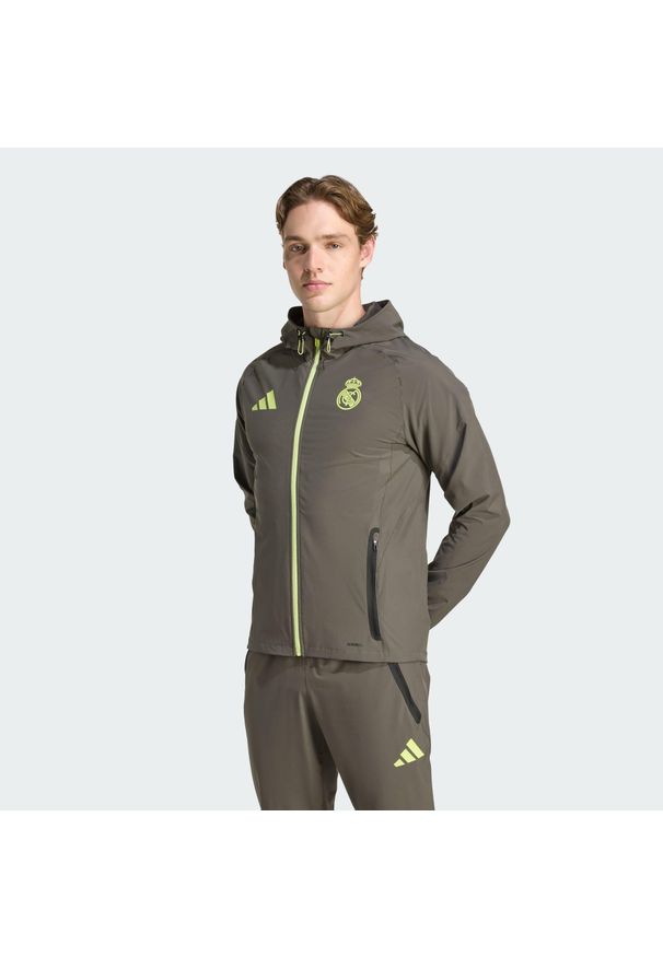 Adidas - Kurtka Real Madrid Tiro 25 Competition Vis Tech Travel Jacket. Kolor: szary, wielokolorowy, żółty. Materiał: dresówka. Sport: piłka nożna