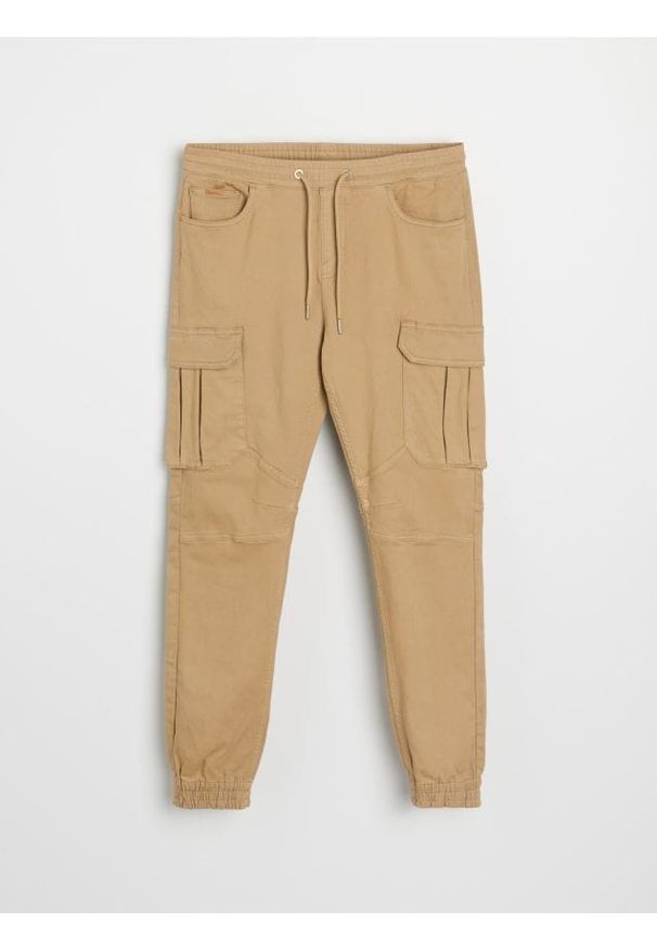 Sinsay - Jeansy regular jogger cargo - żółty. Kolor: żółty